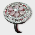 Overview of STONIRA silver cocktail ring with an oval pavé border featuring a central rose quartz flower and marquise-cut crystal bud