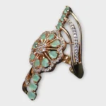 STONIRA adjustable gold cocktail ring with a mint green stone floral rosette and crystal-paved arches side view