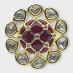Overview of STONIRA gold cocktail ring featuring a central glossy crimson red domed stone with a gold grid overlay and an outer halo of clear teardrop gems