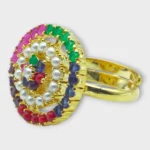 Side view of STONIRA adjustable gold cocktail ring featuring a concentric circular design of multi-colored gemstones and a white pearl halo