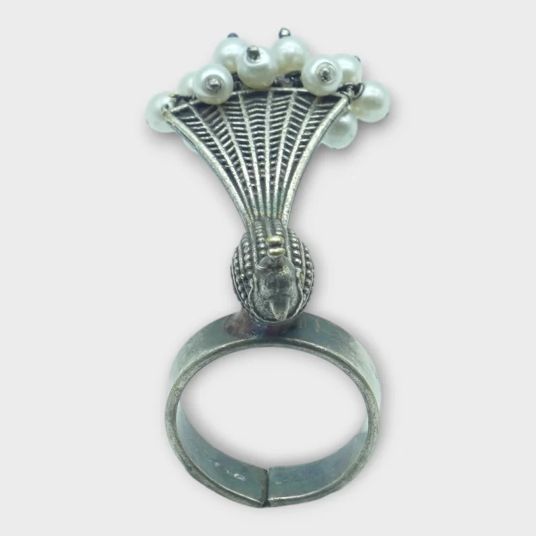 STONIRA adjustable statement ring featuring an oxidised silver peacock with a fan-shaped tail crowned in white pearls overview