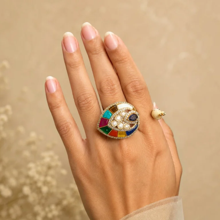 Women wearing STONIRA peacock-inspired adjustable statement ring featuring multicolor enamel tail detailing, crystal embellishments, and a gold-tone finish.