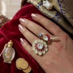 Woman wearing peacock kundan statement ring by STONIRA