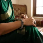 Classic peacock oxidised silver screw kada side view bangle by STONIRA
