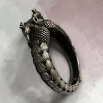 Classic peacock oxidised silver screw kada bangle angle view by STONIRA