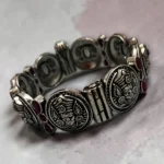 Artisan-crafted STONIRA oxidised silver coin statement bangle with pink stone inlays and side opening