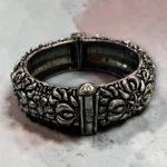Top view of the STONIRA oxidised silver floral statement hinged bangle