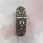 clasp view of the STONIRA oxidised silver floral statement hinged bangle