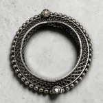 Overview of the STONIRA oxidised silver lattice hinged statement bangle