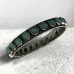 oxidised silver slip-on bangle inlaid with soft mint green stones in size 2.4