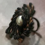 Artisan STONIRA peacock cocktail ring featuring an oversized central pearl and micro-paved colorful crystals adjustable ring