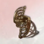 Back of STONIRA adjustable gold cocktail ring with a mint green stone floral rosette and crystal-paved arches