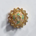 STONIRA adjustable gold statement ring featuring a hand-enameled pastel lotus blossom surrounded by a geometric starburst of clear crystals