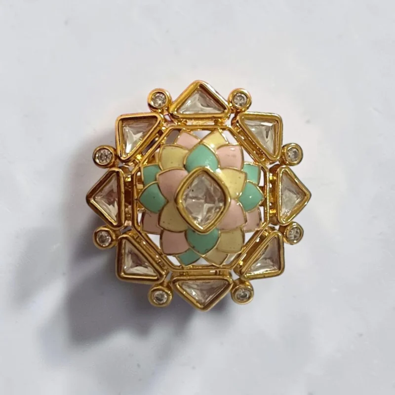 STONIRA adjustable gold statement ring featuring a hand-enameled pastel lotus blossom surrounded by a geometric starburst of clear crystals