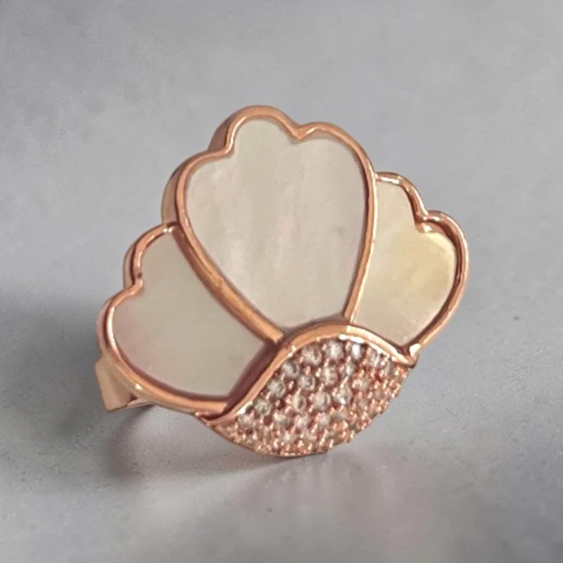 STONIRA adjustable rose gold statement ring featuring a carved Mother of Pearl flower motif anchored by a micro-crystal pave cluster