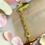 Back view of STONIRA gold crescent moon hathphool ring bracelet