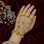 STONIRA-gold-crescent-moon-hathphool-ring-bracelet-draped-on-hand