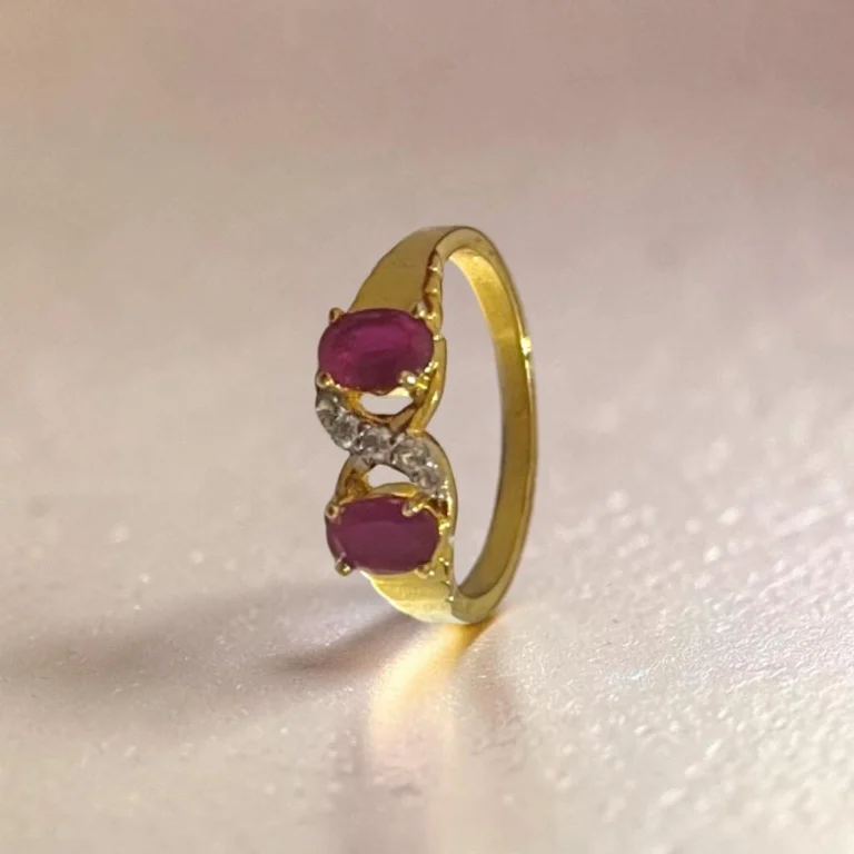 STONIRA-gold-plated-statement-ring-featuring-a-balanced-vertical-alignment-of-two-oval-ruby-pink-gemstones-connected-by-a-delicate-S-curve-of-clear-crystal-pave.