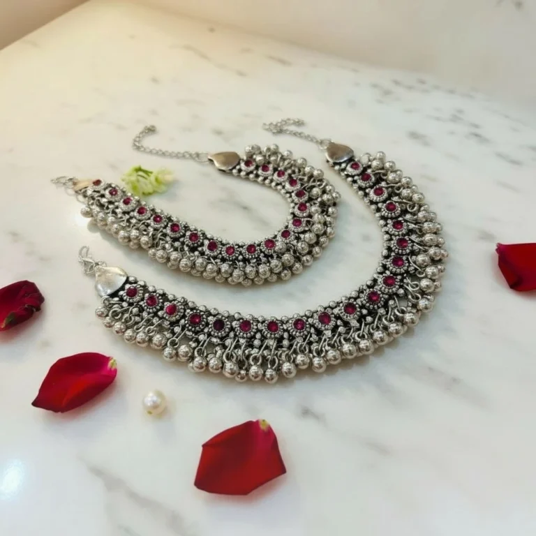 STONIRA-handcrafted-broad-oxidized-silver-payal-set-with-ruby-red-stones-and-dense-ghungroo-bells