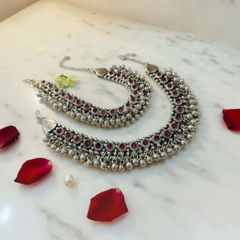 STONIRA-handcrafted-broad-oxidized-silver-payal-set-with-ruby-red-stones-and-dense-ghungroo-bells