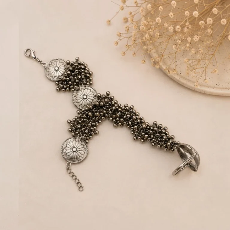 STONIRA oxidised silver floral hathphool hand harness bracelet featuring sunburst medallions and dense ghungroo bell clusters