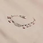 STONIRA-silver-payal-anklets-highlighting-the-layered-chains-and-tiny-silver-bells
