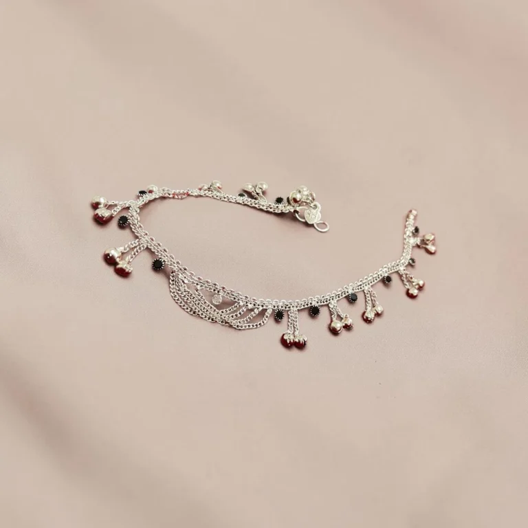 STONIRA-silver-payal-anklets-highlighting-the-layered-chains-and-tiny-silver-bells