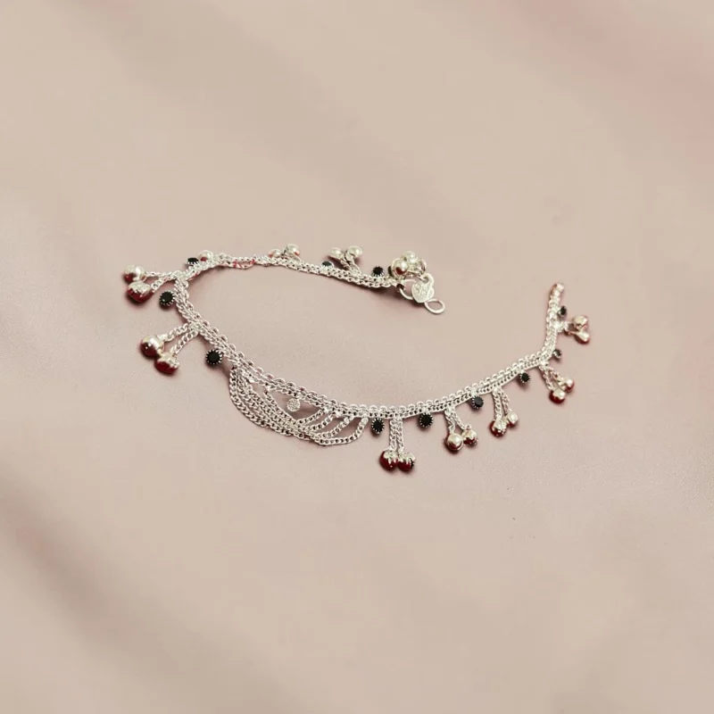 STONIRA-silver-payal-anklets-highlighting-the-layered-chains-and-tiny-silver-bells