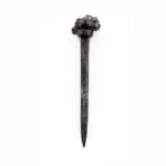 Charcoal grey textured resin hair stick with a sculpted knot