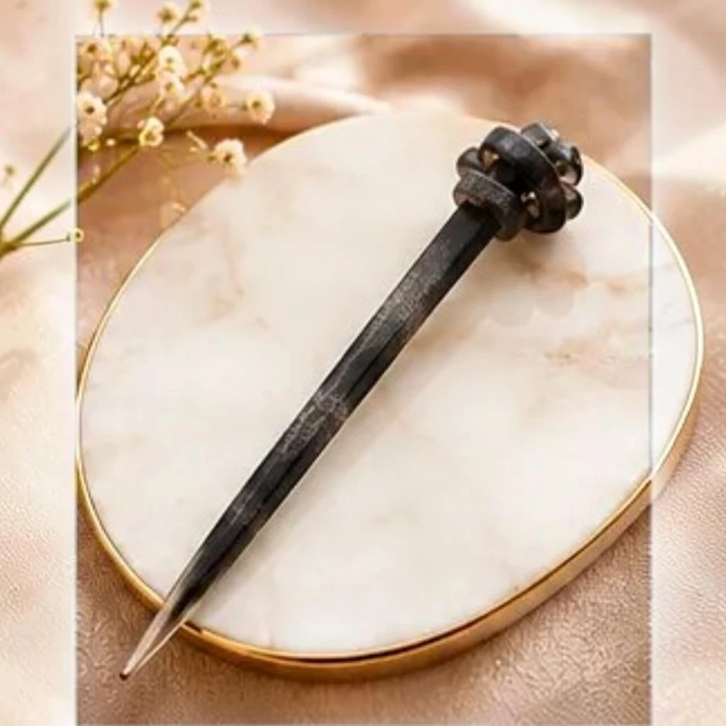 Charcoal grey textured resin hair stick with a sculpted knot accent for buns and updos Charcoal grey textured resin hair stick with a sculpted knot accent for buns and updos.
