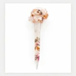 Clear resin hair stick with delicate pink pressed flower inclusions and a sculpted knot accent for buns