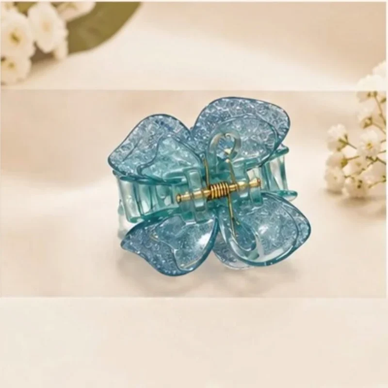 Ocean teal blue resin butterfly hair claw clip with shimmering micro-sparkles