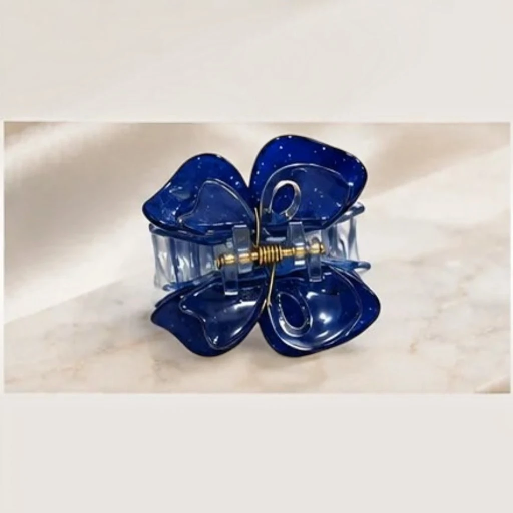 Deep midnight navy blue resin butterfly hair claw clip with a glossy finish. Deep midnight navy blue resin butterfly hair claw clip with a glossy finish.