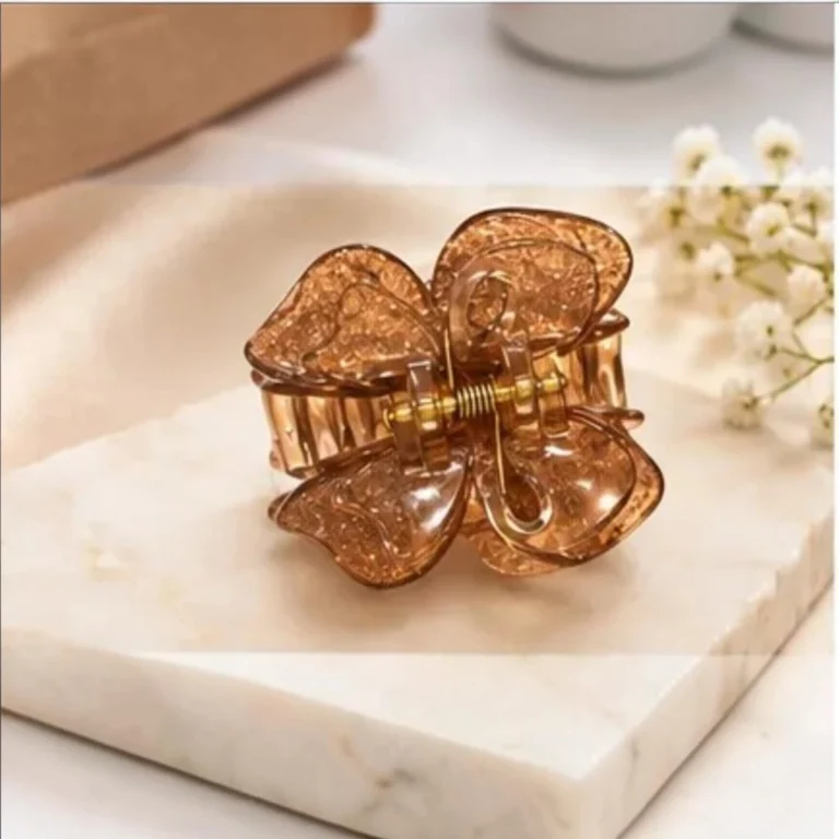 Warm amber bronze resin butterfly hair claw clip infused with fine shimmer