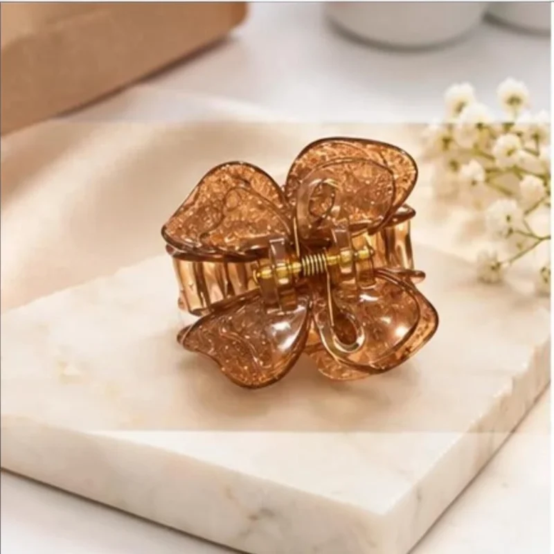 Warm amber bronze resin butterfly hair claw clip infused with fine shimmer